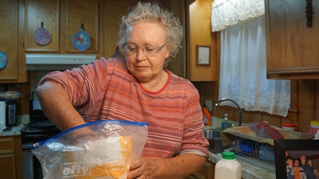 Mama measuring out flour